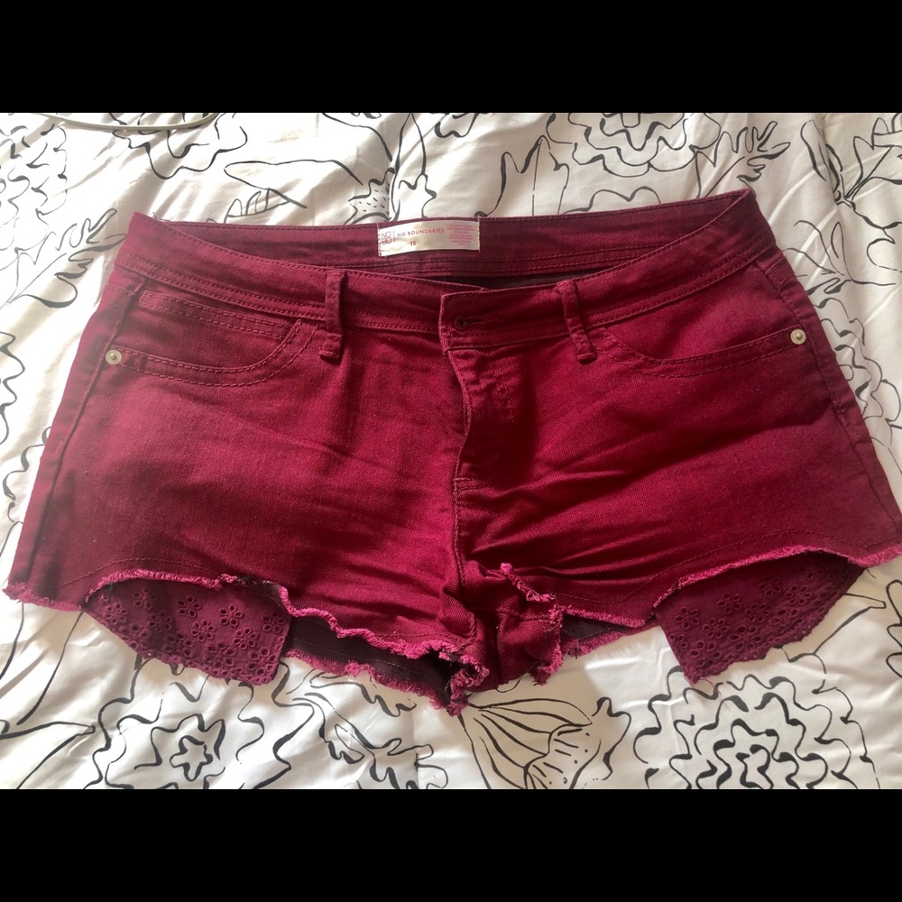 Maroon colored jean shorts